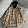 Burberry Veste à capuche réversible à carreaux